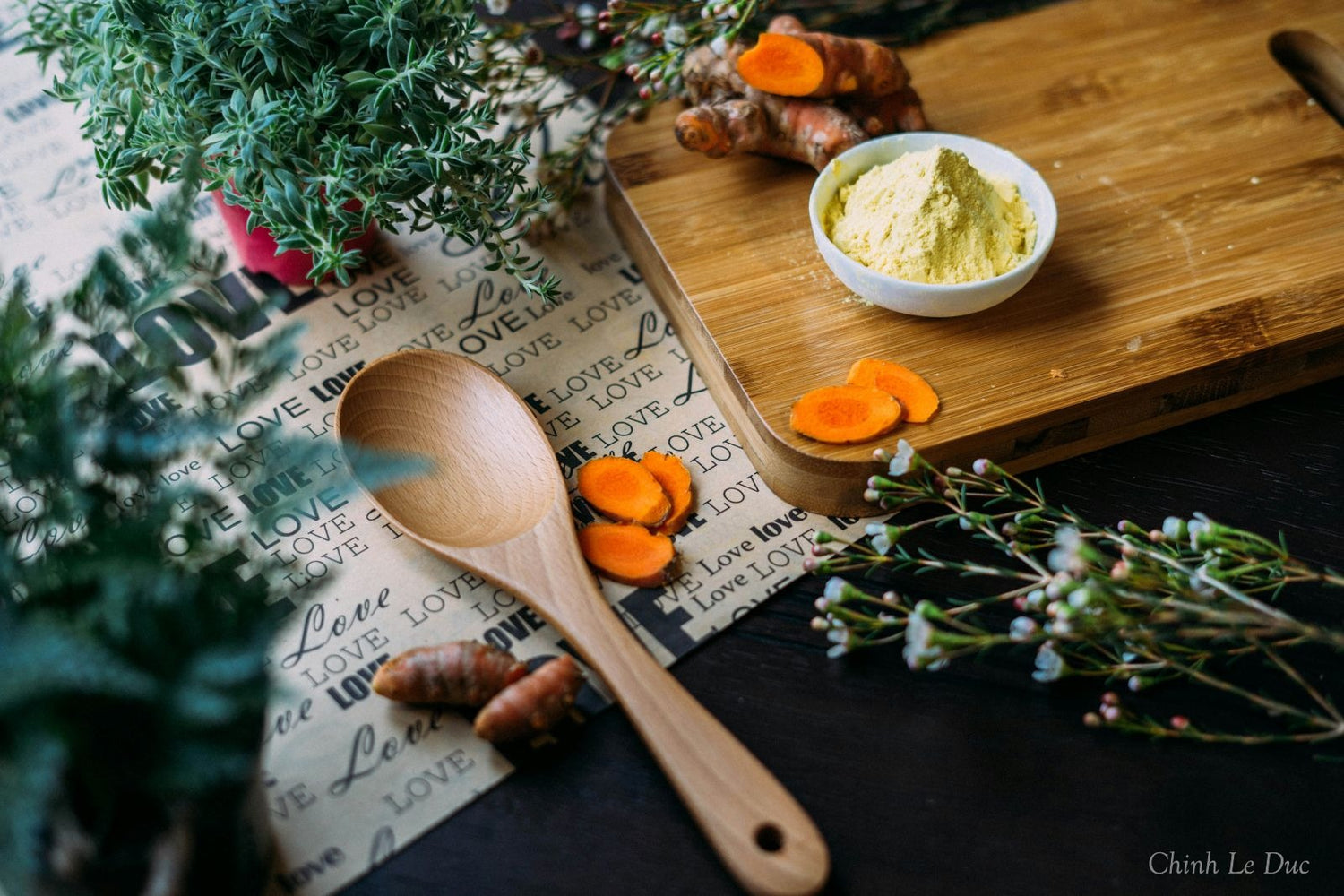 slices of turmeric roots on a wooden plate