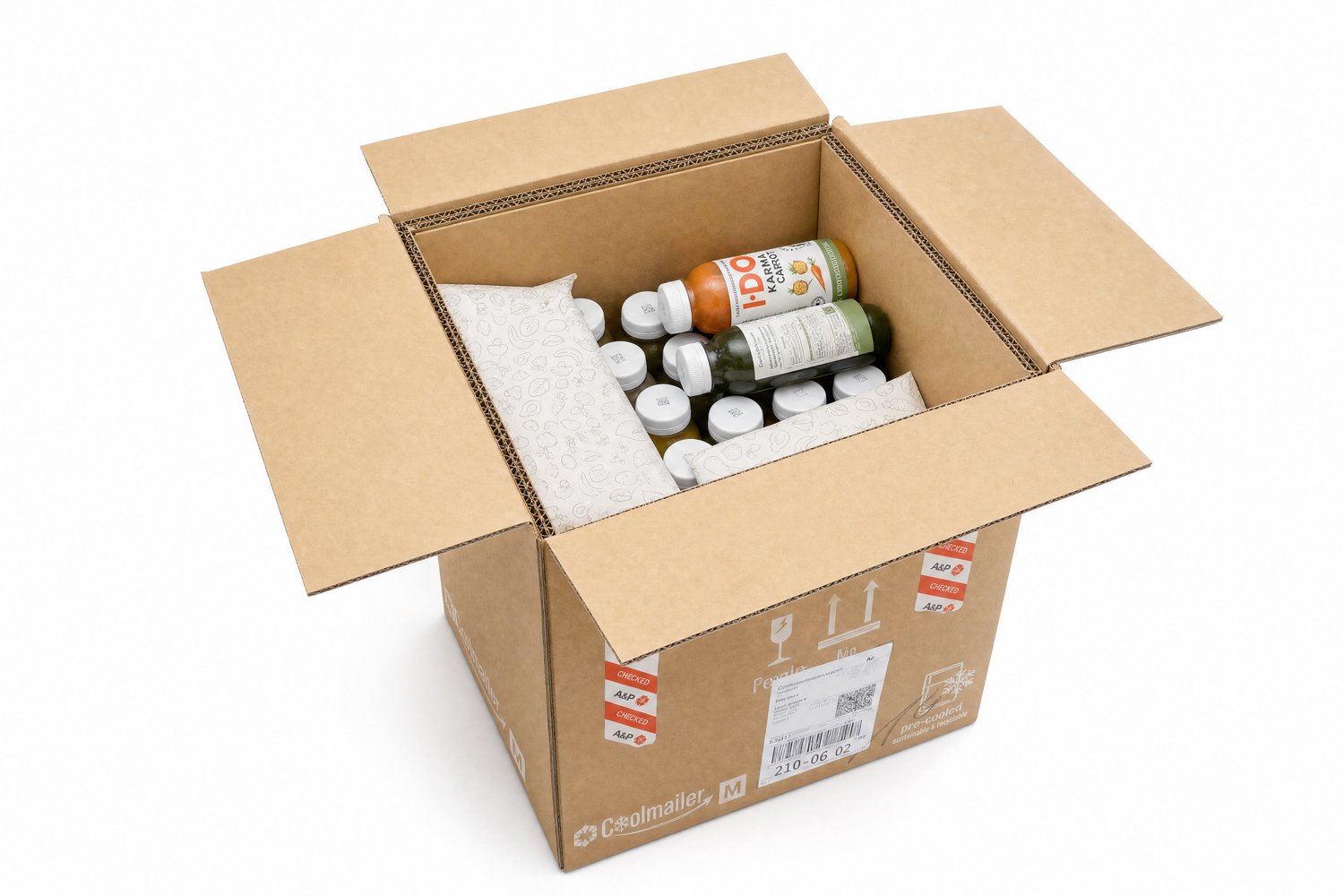 Geöffneter I·DO Versandkarton im Studio – gekühlte Bio-Säfte mit Isolierpolstern sicher verpackt